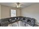 Spacious living room with custom couch and a window for natural light, carpeted floors and neutral walls at 2090 Marbut Ln, Lithonia, GA 30058