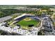 Aerial view of a baseball park in a community, including many restaurants and shops at 2625 Cedar Dr, Lawrenceville, GA 30043