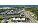 Aerial view of a mixed-use development, showcasing a baseball field, commercial buildings and convenient access to major roads at 2625 Cedar Dr, Lawrenceville, GA 30043