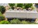 Aerial view of townhomes with gray roofs, surrounded by lush trees and well-maintained grounds at 2625 Cedar Dr, Lawrenceville, GA 30043