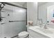 Cozy bathroom with updated vanity, a toilet, sink, and shower boasting bronze hardware at 2625 Cedar Dr, Lawrenceville, GA 30043