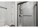 Clean bathroom with a shower boasting bronze hardware and easy-to-clean glass doors at 2625 Cedar Dr, Lawrenceville, GA 30043