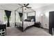 This spacious bedroom features natural light, a ceiling fan, and modern decor for a relaxing retreat at 2625 Cedar Dr, Lawrenceville, GA 30043