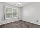 Bright bedroom with natural light and neutral carpeting at 2625 Cedar Dr, Lawrenceville, GA 30043
