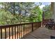 Enjoy the outdoors on this wooden deck, surrounded by trees and offering a serene view at 2625 Cedar Dr, Lawrenceville, GA 30043