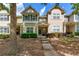 Charming townhome with green shutters, a well-maintained lawn, and inviting front steps at 2625 Cedar Dr, Lawrenceville, GA 30043