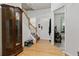 Bright and inviting foyer features hardwood floors, a staircase, and elegant decor at 2625 Cedar Dr, Lawrenceville, GA 30043
