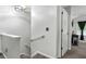 Bright hallway features a staircase with modern handrail, leading to additional rooms and living spaces at 2625 Cedar Dr, Lawrenceville, GA 30043