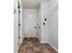 Neutral hallway featuring tile flooring and a white door for a clean, modern look at 2625 Cedar Dr, Lawrenceville, GA 30043