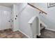 Neutral hallway featuring tile flooring, a staircase, and a white door for a clean, modern look at 2625 Cedar Dr, Lawrenceville, GA 30043