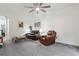 Spacious living room features two sofas, recliner, and fan for comfortable seating at 2625 Cedar Dr, Lawrenceville, GA 30043