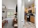 View of open floor plan combining a traditional living room and kitchen at 2625 Cedar Dr, Lawrenceville, GA 30043