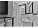 A sleek bathroom with a black and white color scheme features classic subway tiles and a modern vanity at 301 10Th Ne St # 12, Atlanta, GA 30309