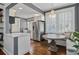 Charming kitchen nook features built-in bench seating and modern chandelier at 301 10Th Ne St # 12, Atlanta, GA 30309