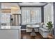 Bright kitchen nook with built-in bench seating, chandelier, and natural light at 301 10Th Ne St # 12, Atlanta, GA 30309