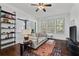 Cozy living room with hardwood floors, ceiling fan, and comfortable seating area at 301 10Th Ne St # 12, Atlanta, GA 30309