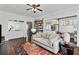 Bright living room features hardwood floors, ceiling fan, and large sofa at 301 10Th Ne St # 12, Atlanta, GA 30309