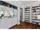 Elegant living room showcases mirrored cabinets and open shelving for storage at 301 10Th Ne St # 12, Atlanta, GA 30309