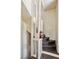 A spiral staircase with brown treads and white risers features a unique, minimalist white wooden banister at 301 10Th Ne St # 12, Atlanta, GA 30309
