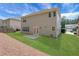 Home's backyard features a well-maintained lawn, neutral siding, and double doors leading inside at 3208 Juniper Nw Dr, Kennesaw, GA 30144