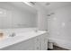 Well-lit bathroom featuring a double vanity, and a shower-tub combo with white tile at 3208 Juniper Nw Dr, Kennesaw, GA 30144