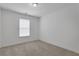 Bright bedroom with neutral carpet, features a light-filled window, and offers a serene atmosphere at 3208 Juniper Nw Dr, Kennesaw, GA 30144