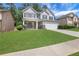 Charming two-story home with lush lawn, classic curb appeal, and a two-car garage at 3208 Juniper Nw Dr, Kennesaw, GA 30144