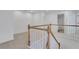 Hallway with wood banister and white railing, with access to the second floor at 3208 Juniper Nw Dr, Kennesaw, GA 30144