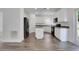 Spacious kitchen with white cabinets, black appliances, and a center island at 3208 Juniper Nw Dr, Kennesaw, GA 30144