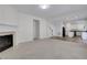 Bright living room with fireplace open to the kitchen, creating an inviting space at 3208 Juniper Nw Dr, Kennesaw, GA 30144