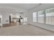 Living room with big windows, and open view to the kitchen and access to the backyard at 3208 Juniper Nw Dr, Kennesaw, GA 30144