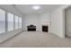 Inviting living room with a fireplace, plenty of natural light, and neutral color palette at 3208 Juniper Nw Dr, Kennesaw, GA 30144