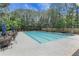 Community swimming pool with ample seating and umbrellas for a relaxing experience at 3208 Juniper Nw Dr, Kennesaw, GA 30144