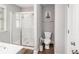 Bathroom featuring a glass shower and toilet at 7762 Fawn Cir, Covington, GA 30014