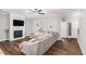 Spacious living room with hardwood floors, fireplace and a comfortable sectional sofa at 7762 Fawn Cir, Covington, GA 30014
