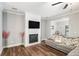 Comfortable living room featuring a fireplace and large television for relaxation at 7762 Fawn Cir, Covington, GA 30014