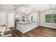 Living space highlighting the seamless flow between the kitchen, dining area, and living room at 7762 Fawn Cir, Covington, GA 30014
