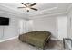 Spacious bedroom with a ceiling fan, recessed lighting, and carpeted flooring at 7762 Fawn Cir, Covington, GA 30014