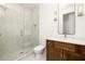 Modern bathroom features a glass shower with decorative tile and a vanity with a marble countertop at 11542 Serenbe Ln, Chattahoochee Hills, GA 30268