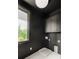 Contemporary laundry room with ample counter space, and modern appliances at 11542 Serenbe Ln, Chattahoochee Hills, GA 30268