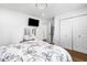 Bedroom with hardwood floors, closet, and built-in vanity at 4439 Luther Ward Rd, Powder Springs, GA 30127