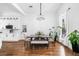 Dining room with modern chandelier, seating for six, hardwood floors and lots of natural light at 4439 Luther Ward Rd, Powder Springs, GA 30127