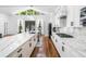 Modern kitchen featuring quartz countertops, stainless steel appliances, and a gas cooktop at 4439 Luther Ward Rd, Powder Springs, GA 30127