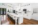 Bright kitchen with stainless steel appliances, large island with seating, and natural light at 4439 Luther Ward Rd, Powder Springs, GA 30127