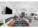Living room featuring a modern fireplace, hardwood floors, vaulted ceilings and comfortable seating at 4439 Luther Ward Rd, Powder Springs, GA 30127