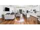 Open-concept living room with a modern fireplace, vaulted ceilings, and lots of natural light at 4439 Luther Ward Rd, Powder Springs, GA 30127