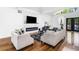Living room with modern fireplace, hardwood floors, comfortable seating and vaulted ceilings at 4439 Luther Ward Rd, Powder Springs, GA 30127