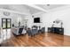 Open living room area with hardwood flooring, fireplace, and modern decor at 4439 Luther Ward Rd, Powder Springs, GA 30127