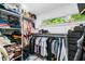 Well-organized walk-in closet with ample storage, hanging space, and a window for natural light at 4439 Luther Ward Rd, Powder Springs, GA 30127