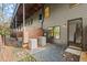Backyard patio with privacy fence, air conditioning unit, and exterior entrance into the home at 2335 Mason Dr # D27, Atlanta, GA 30316
